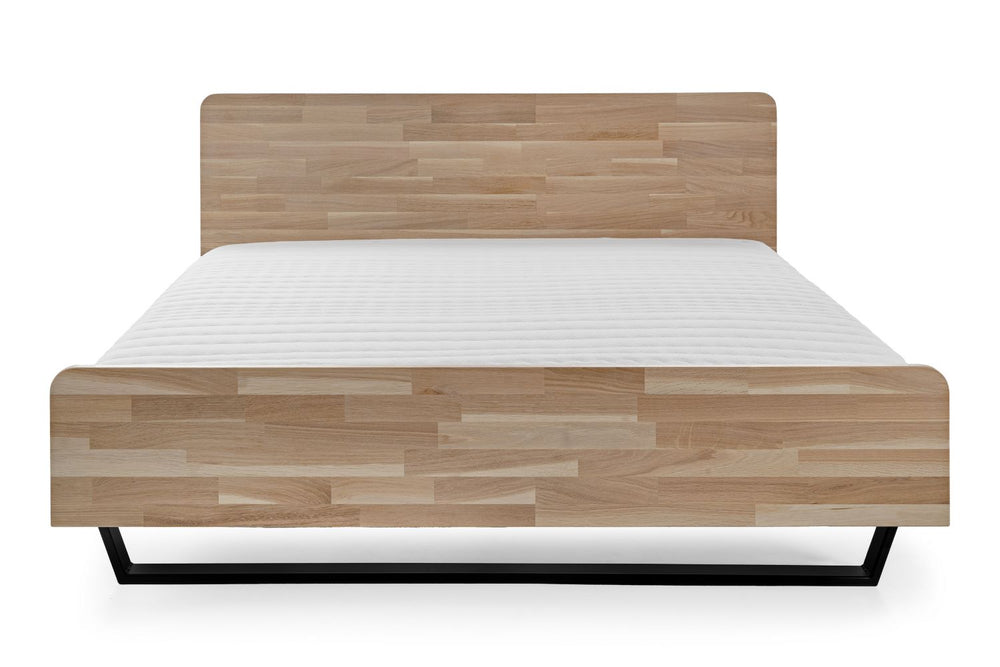 Łóżko dębowe Tammi z płozami